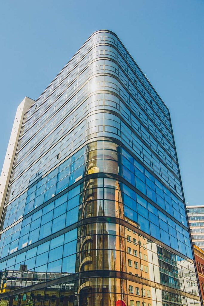 Low angle view of modern office building against b 2023 11 27 05 37 12 utc copy.jpg