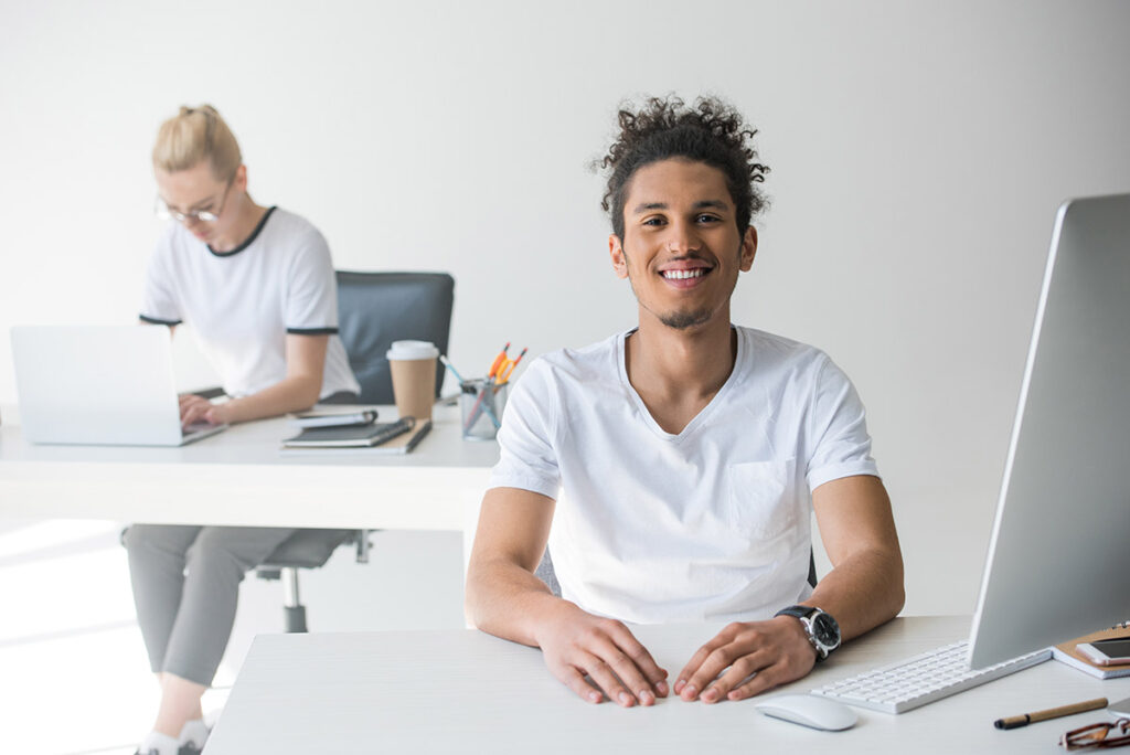 Young african american man smiling at camera while 2023 11 27 04 49 54 utc copy.jpg